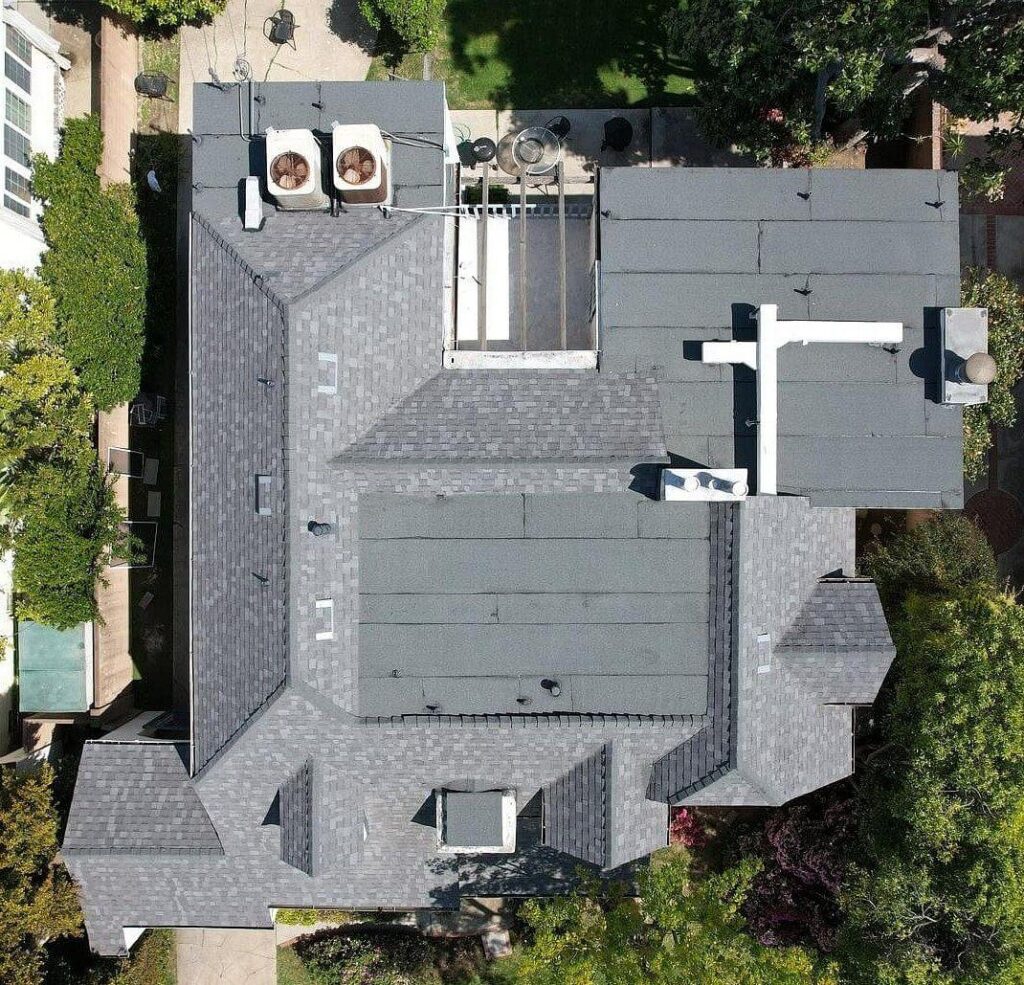 large residential roof with gray asphalt shingles and HVAC equipment, featured in the project gallery by Roofing Angels in Woodland Hills
