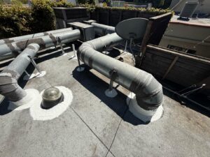 Flat roof coating or repair application on residential property by Roofing Angels in Los Angeles, CA